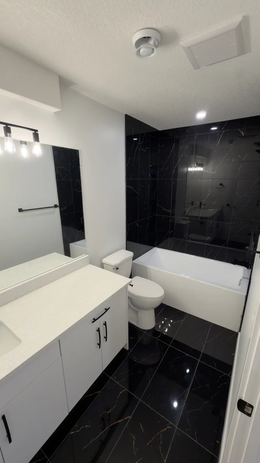 Bathroom renovation, marble tile and floating vanity