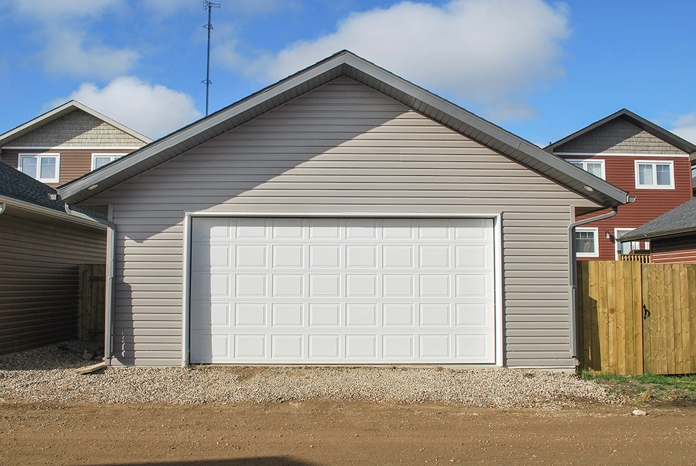 Double garage with matching siding and soffit